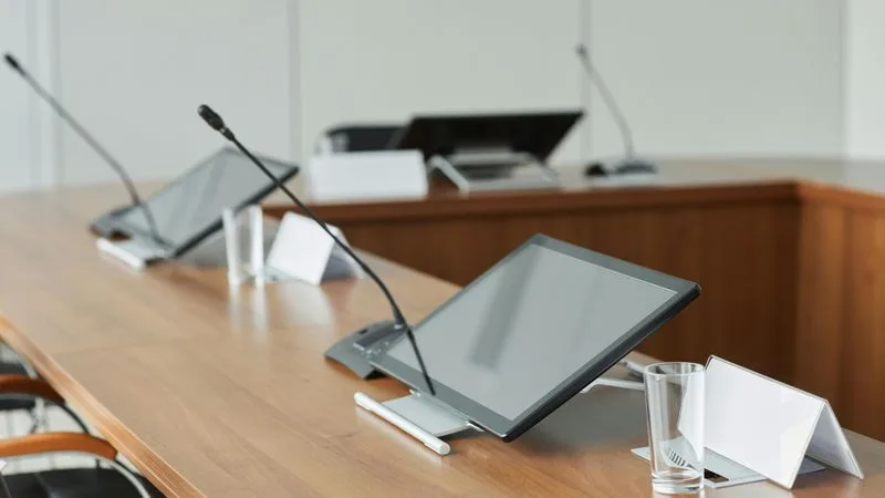 Real-time transcript appearing during a video meeting on a laptop