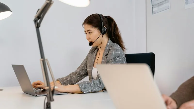 Person dictating to a phone with speech to text converting voice into written text